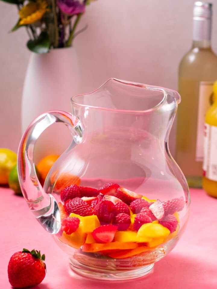 raspberries and strawberries added to the pitcher