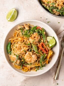 Peanut noodles with shrimp and vegetables tossed in creamy coconut peanut sauce
