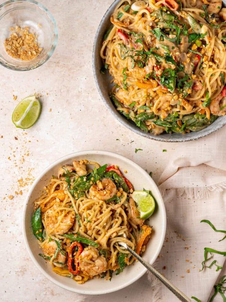 Peanut noodles with shrimp and vegetables tossed in creamy coconut peanut sauce