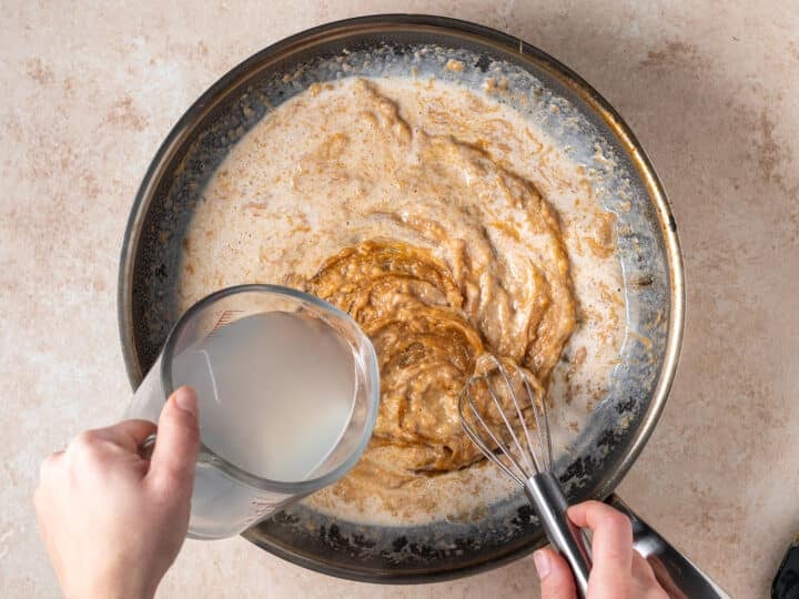 Adding pasta water to creamy peanut sauce