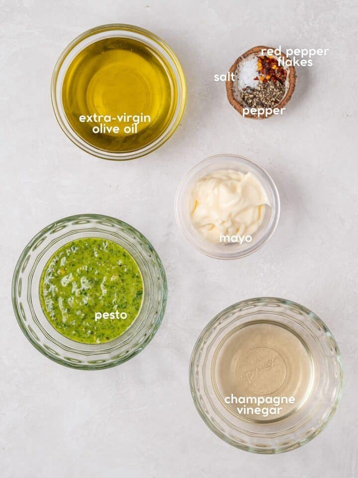 Labeled ingredients including pesto, extra-virgin olive oil, champagne vinegar, mayo, salt, pepper, and red pepper flakes.