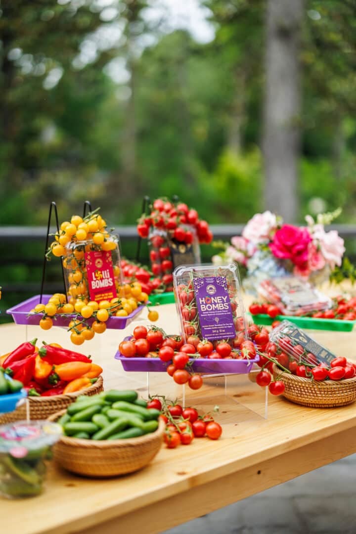 display of honey bombs tomatoes, cucumbers and mini peppers