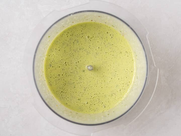 blended pesto dressing in a food processor