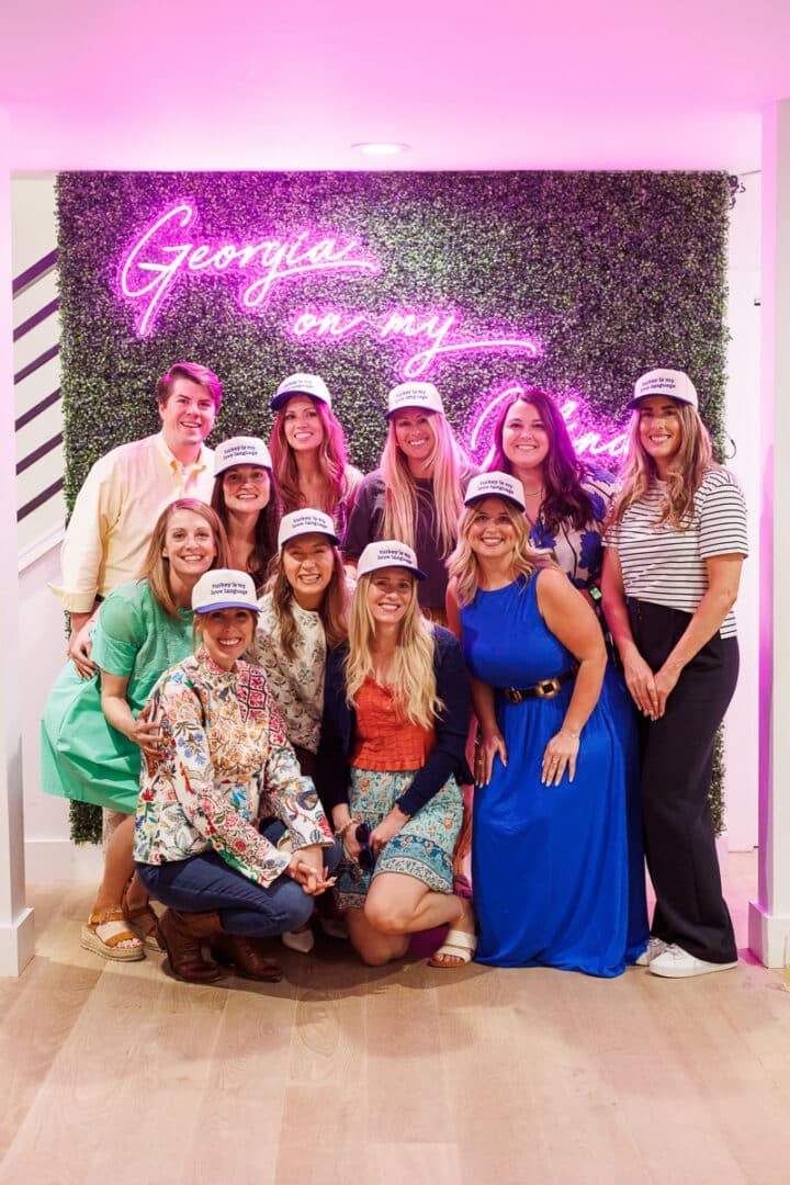 group of girls wearing Butterball baseball caps