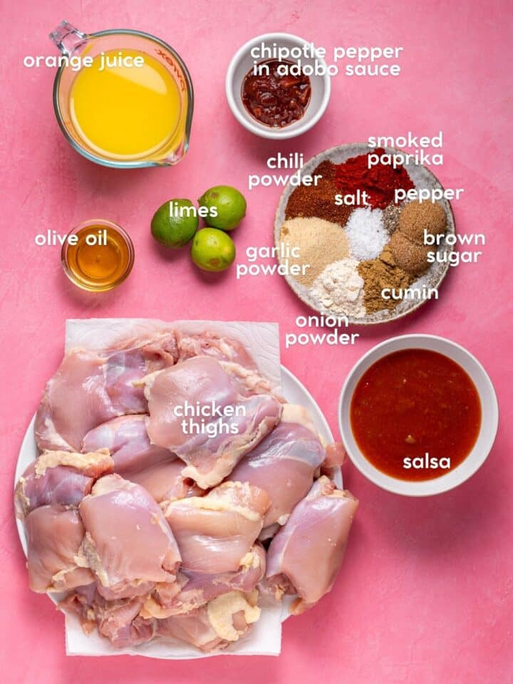 Ingredients for recipe including chicken thighs, salsa, orange juice, lime juice, chipotle peppers, olive oil, and spices.