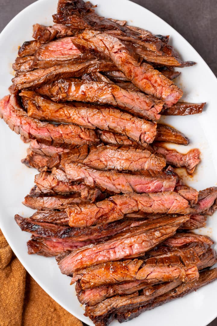 Tender slices of grilled skirt steak after cooking in a flavorful balsamic soy marinade.