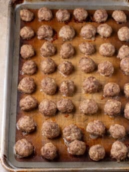 Tray of tender baked beef and ricotta meatballs.