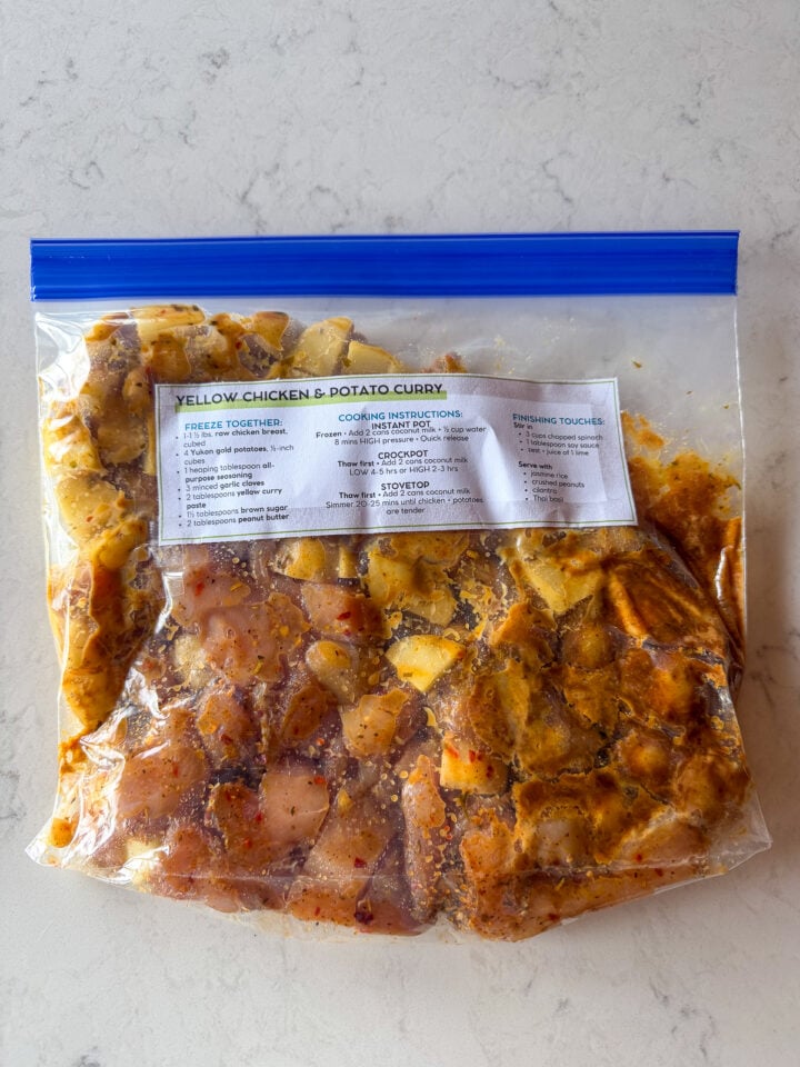 Chicken and potato curry freezer meal prep in a labeled gallon bag for an easy make-ahead dinner